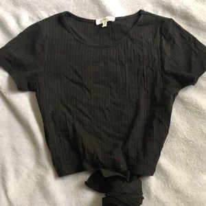 Black crop top , back of shirt is open in the back